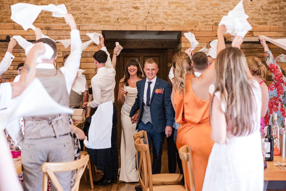 Happy wedding guests and coupl