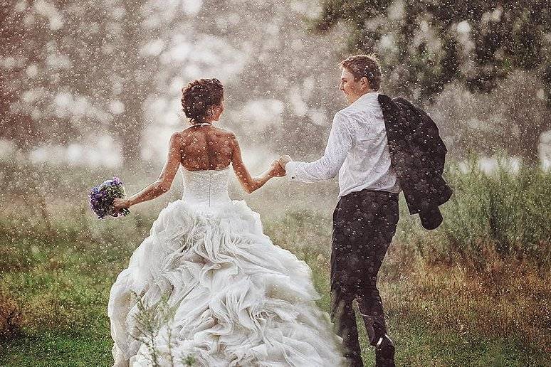 Title cropped. Couple in rain.