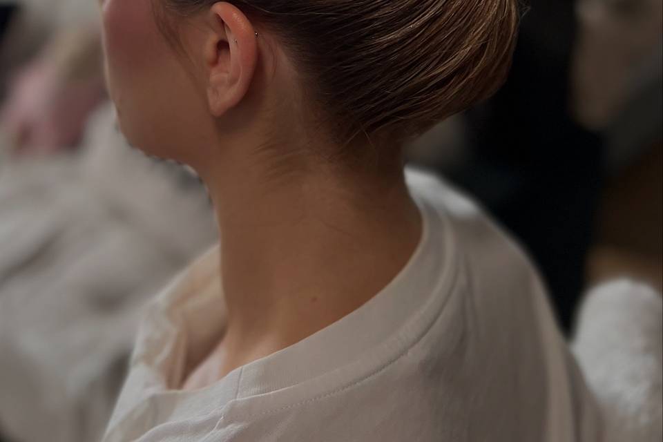 A sleek hairstyle with bun