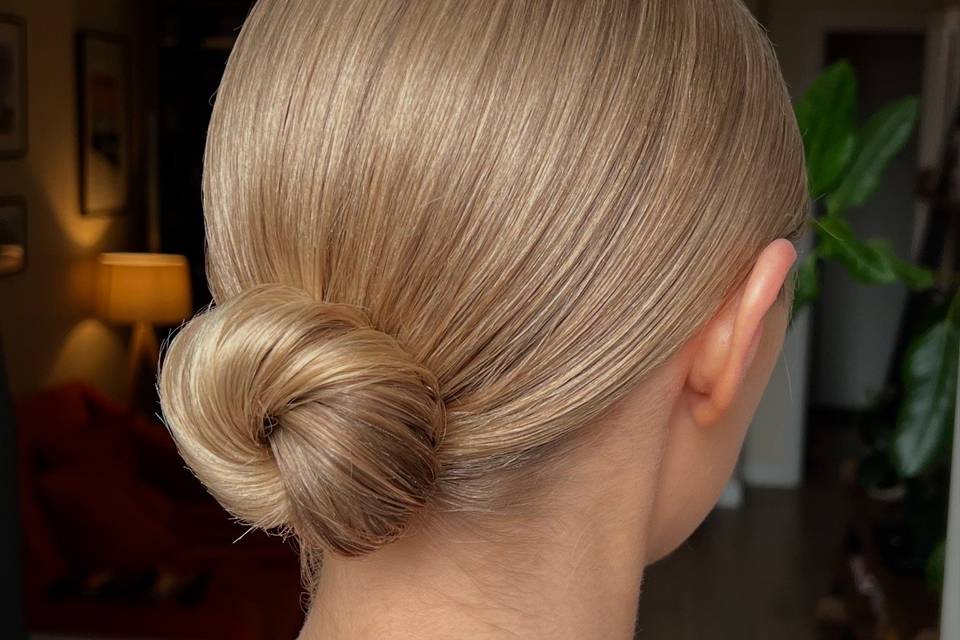 A sleek hairstyle with low bun