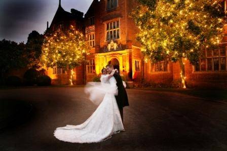 Bride & Groom at the front of the hotel