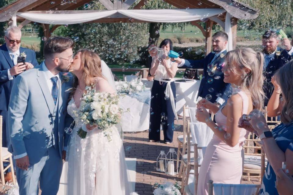Bride and groom first kiss