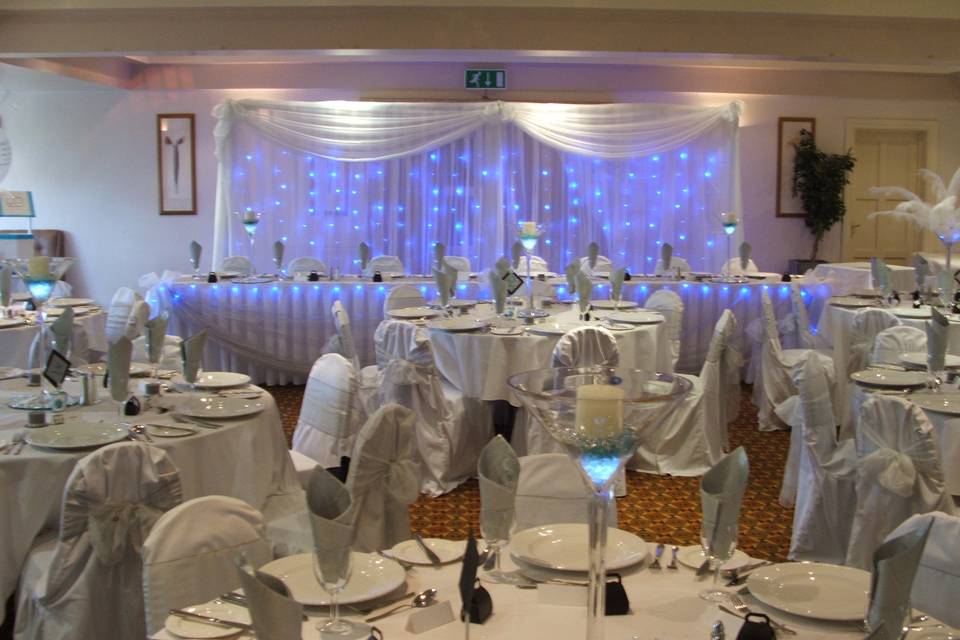 Registrars table with chair covers and cloud balloons