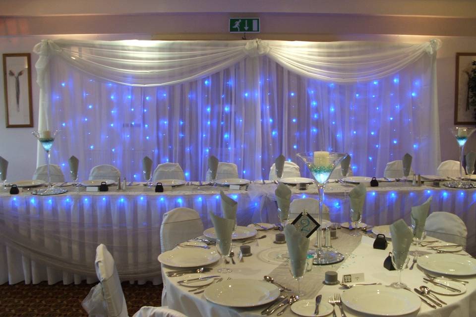 Twinkly curtains with sashes and swags