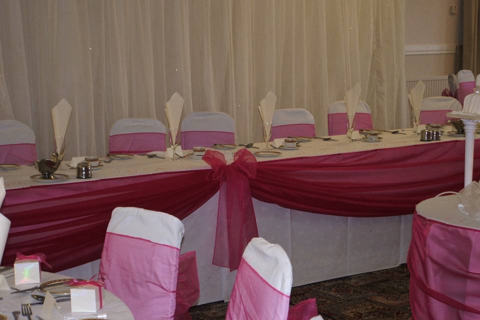 Chair covers and feathers in vases