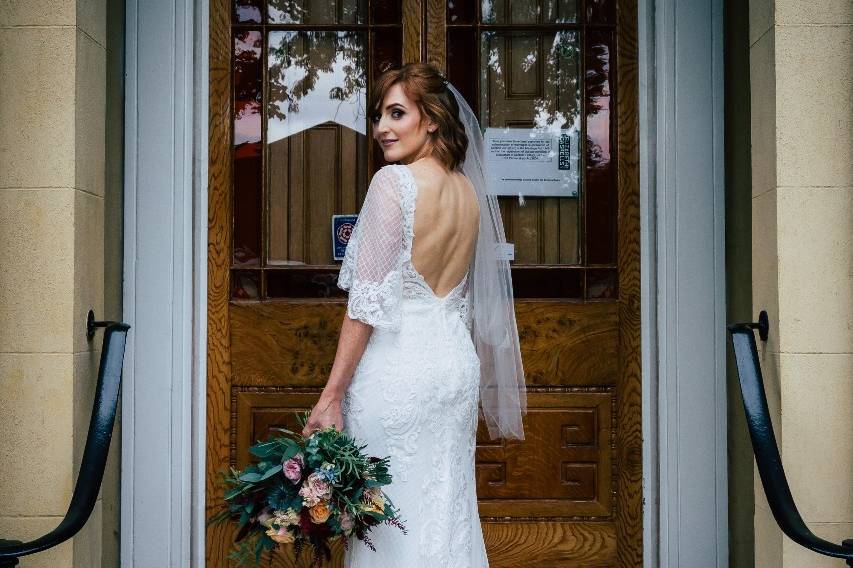 Bride on steps by Sean Coathup