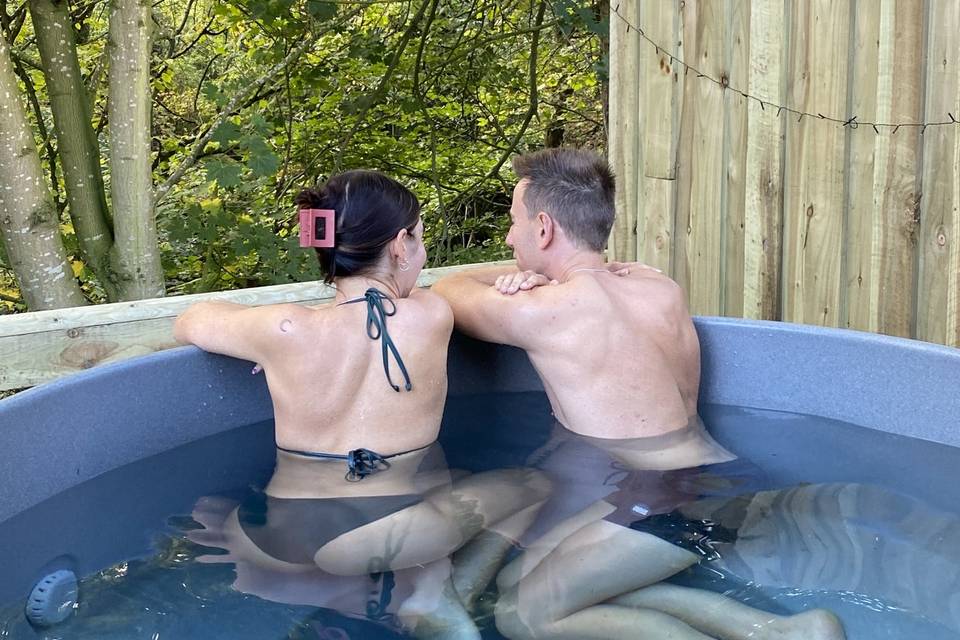 Couple in lodge hot tub