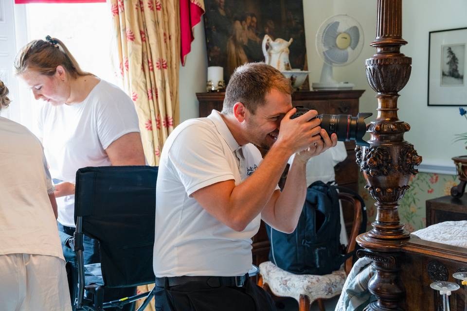 Seated videographer