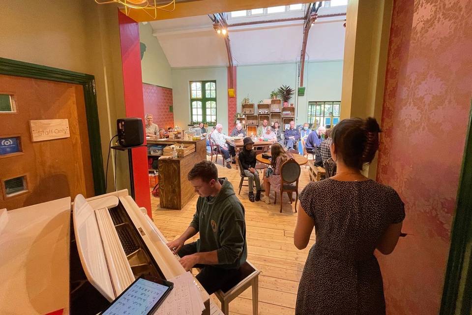 Grand piano in our cafe space