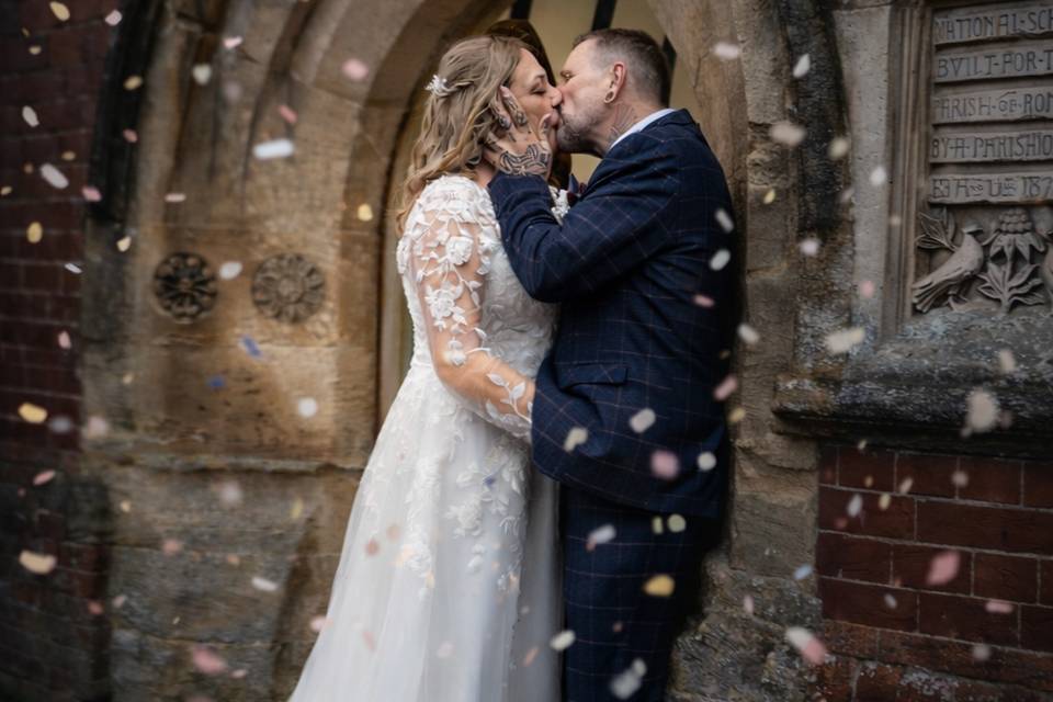 A quick kiss under the confett