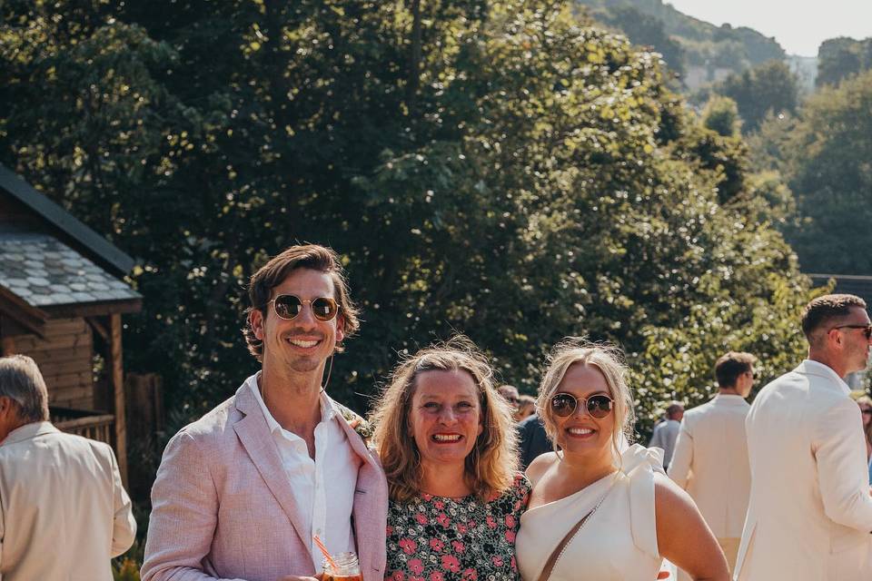 Couple and celebrant smiling