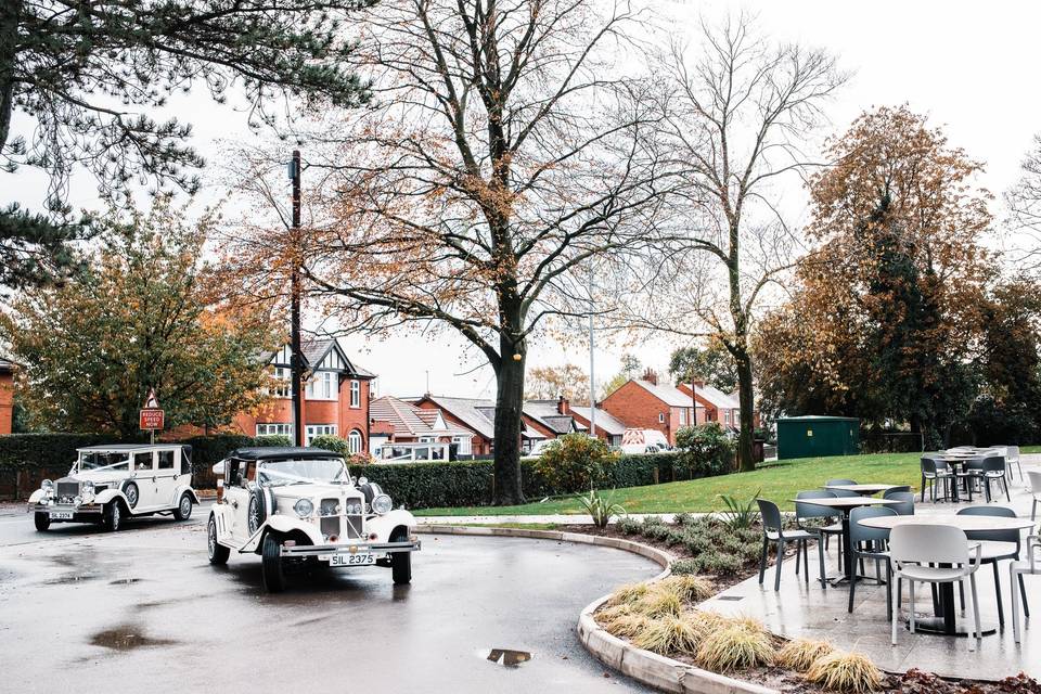 Vintage cars pulling up