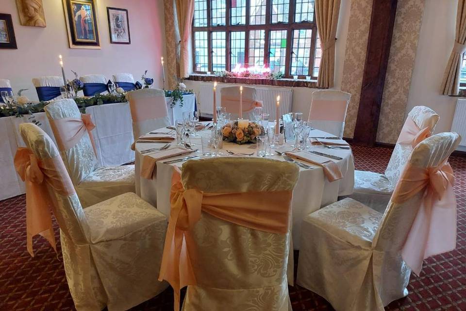 Table dressed with pink sashes