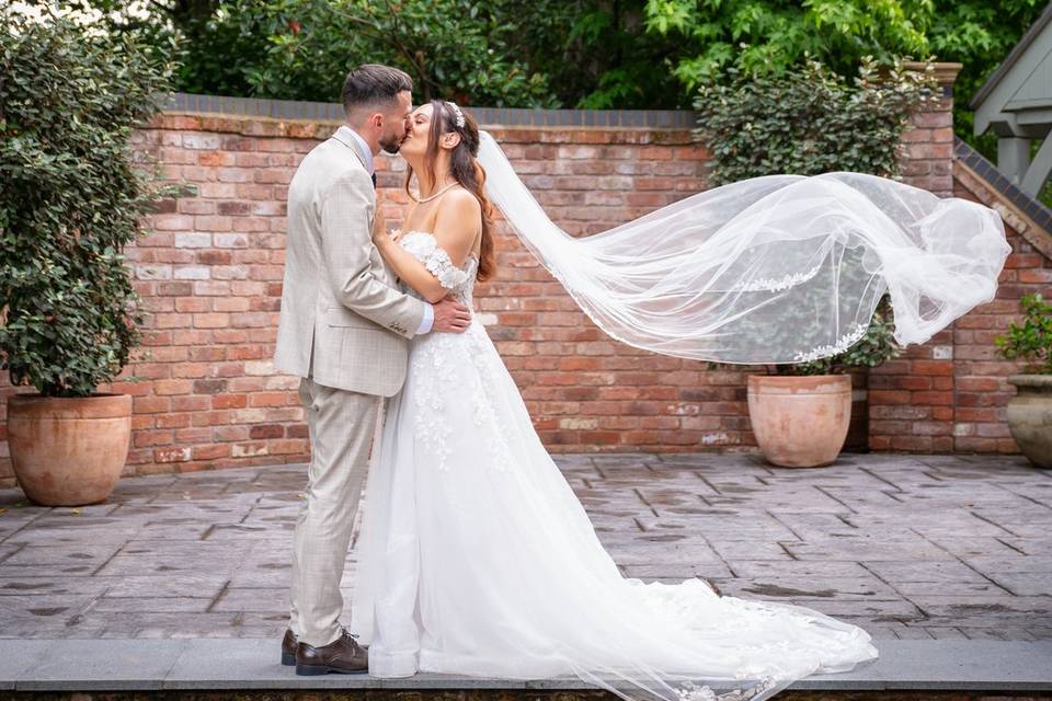 Bride and groom, veil shot
