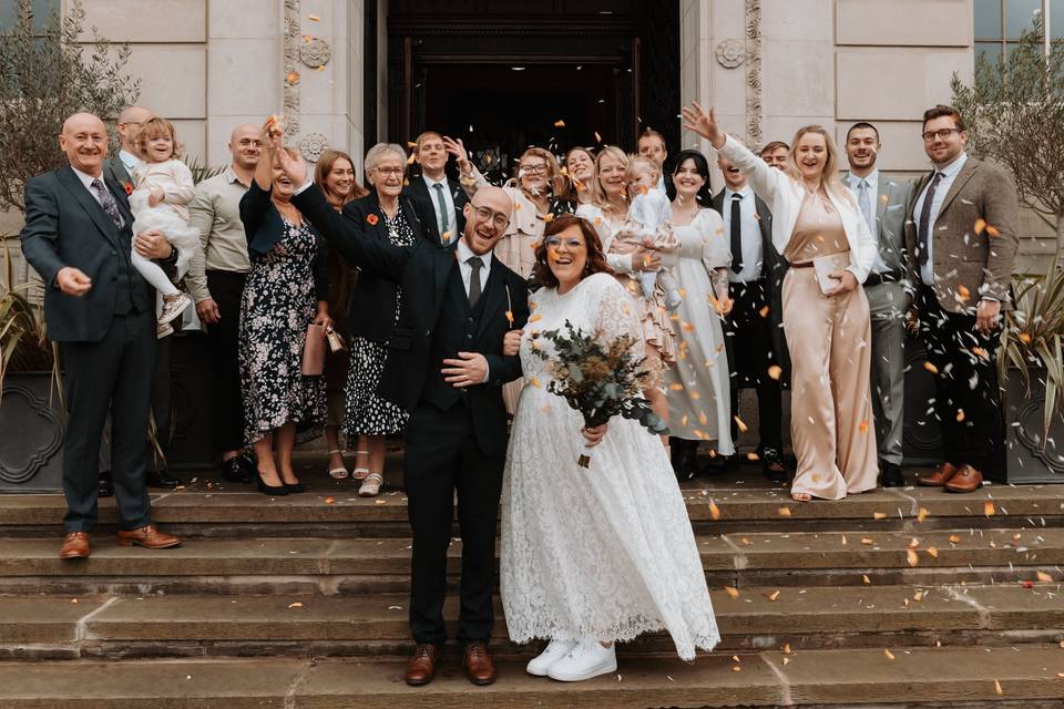 Group and confetti on the stairs