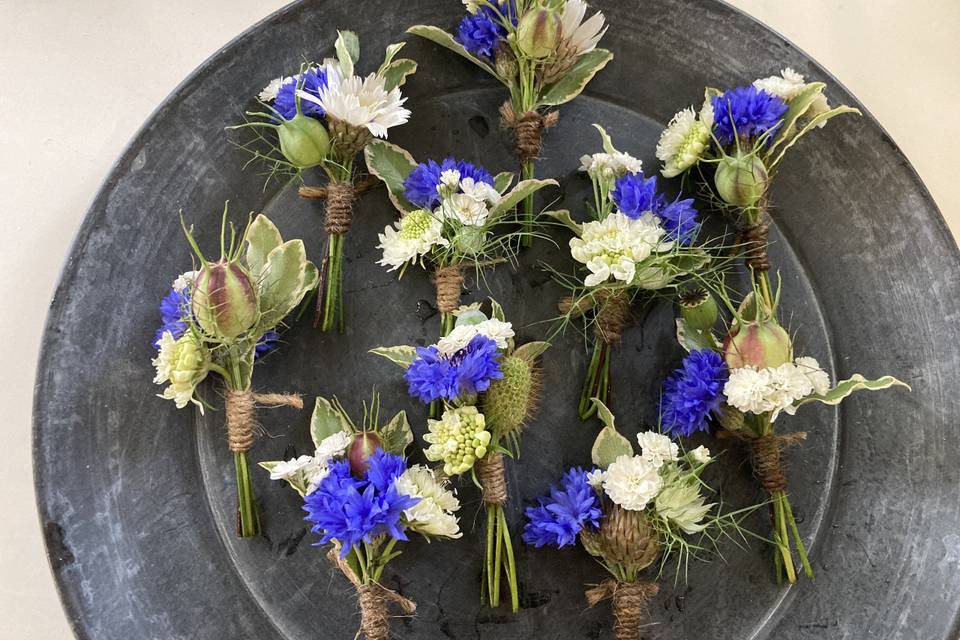 Buttonholes with a pop of colour