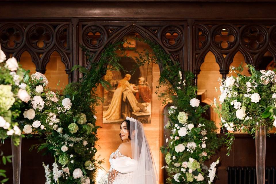 Bride at floral arch