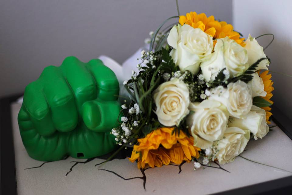 Flowers with a green hand